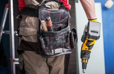 Close-up of man holding equipment