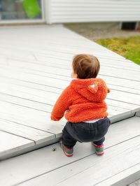 Toddler learning to climb stairs