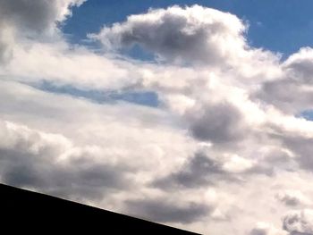 Low angle view of silhouette building against sky