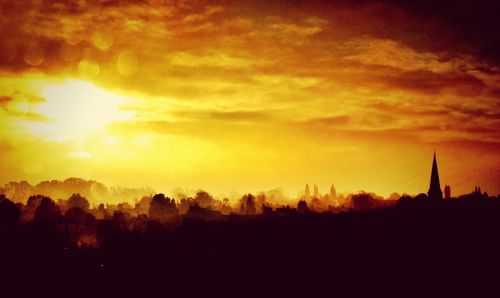 Scenic view of silhouette landscape against sky during sunset