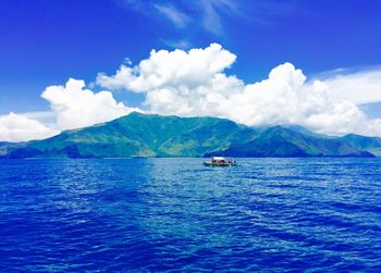 Scenic view of sea against cloudy sky