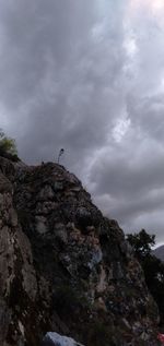 Low angle view of rock formation against sky