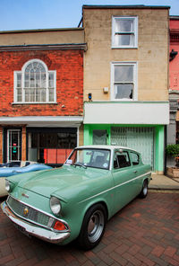 View of car on street against buildings