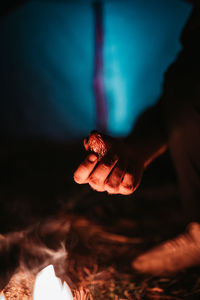 Close-up of hand holding bonfire