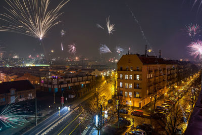 Firework display over buildings in city 