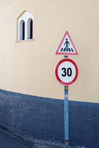 Road sign against clear sky