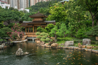 Scenic view of lake against buildings