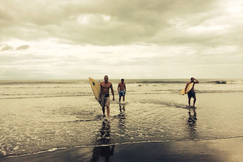 water, sea, sky, horizon over water, beach, cloud - sky, lifestyles, men, leisure activity, walking, full length, shore, cloudy, cloud, person, rear view, vacations, standing