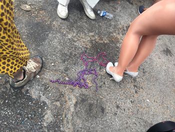 Low section of people standing on road during carnival