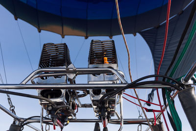 Low angle view of man on machinery