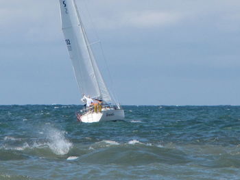 Boat in sea against sky