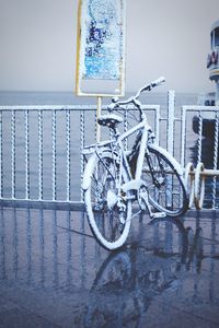 Bicycle parked against water
