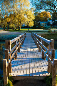 Empty bench in park during autumn