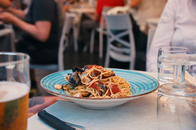 Seafood with pasta on the table in restaurant