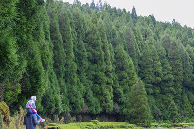 Full length of woman amidst trees