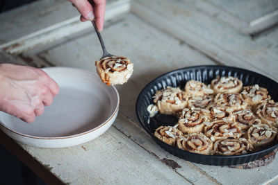 High angle view of human hand serving dessert