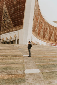 Full length of man standing in historic building