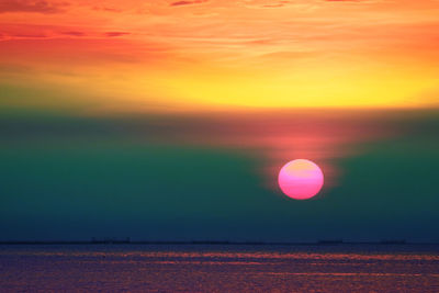 Scenic view of sea against romantic sky at sunset