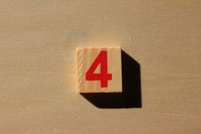 Close-up of number 4 on wood