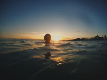 Scenic view of beach against sky during sunset