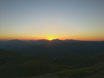 Scenic view of mountains at sunset