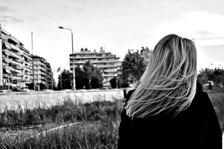 long hair, rear view, sky, standing, building exterior, lifestyles, water, grass, person, waist up, leisure activity, architecture, built structure, young women, outdoors, day, field, headshot