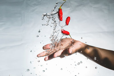 Close-up of woman hand with water