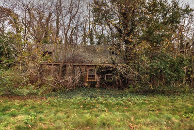 Abandoned building on field