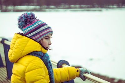 Portrait of girl standing by lake