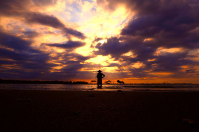 Scenic view of calm sea against cloudy sky