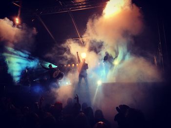 Rear view of people enjoying music concert