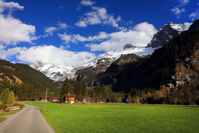 Scenic view of landscape and mountains against sky