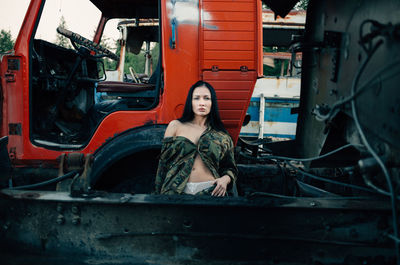 Portrait of young woman in bus