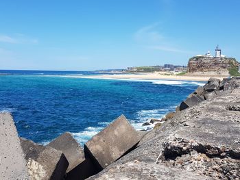 Scenic view of sea against blue sky