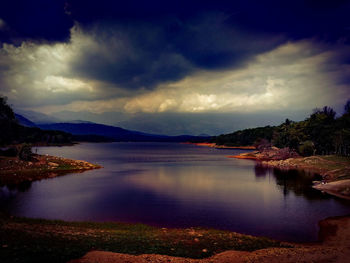 Scenic view of sea against cloudy sky