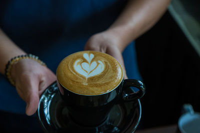 Man holding coffee cup