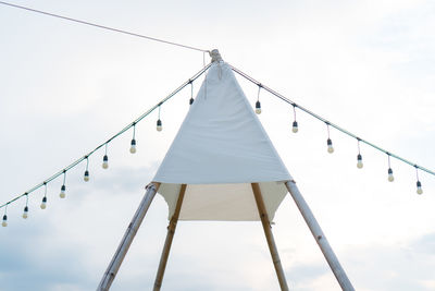 Low angle view of clothes hanging against the sky