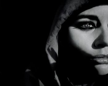 Woman looking at camera over black background