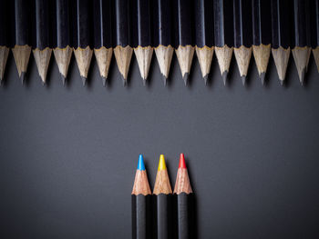 Close-up of colored pencils against black background