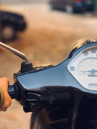 Close-up of human hand holding bicycle