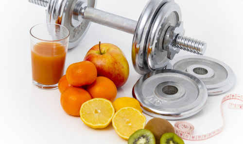 High angle view of oranges in glass container