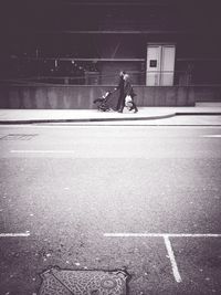 Rear view of man walking on street