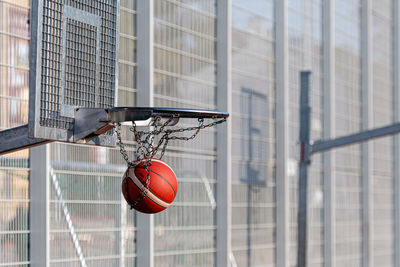 Basketball hoops of different heights in a public sports field