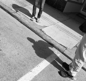 Shadow of people on road