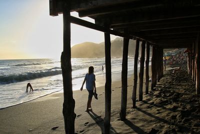 Woman standing on beach