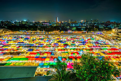 High angle view of illuminated buildings in city at night