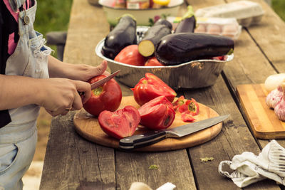 High angle view of man preparing food on cutting board