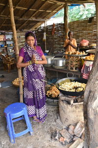 Full length of woman having food