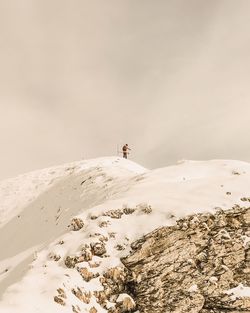 Scenic view of snow covered mountain against sky