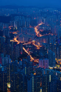 High angle view of illuminated buildings in city at night